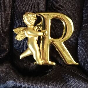 L. Razza  Angel Holding Letter R Brooch